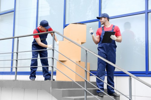 Professionals handling furniture during removal