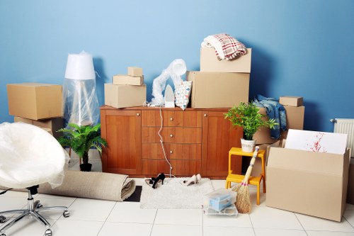 Professional movers handling fragile items with care during a move.