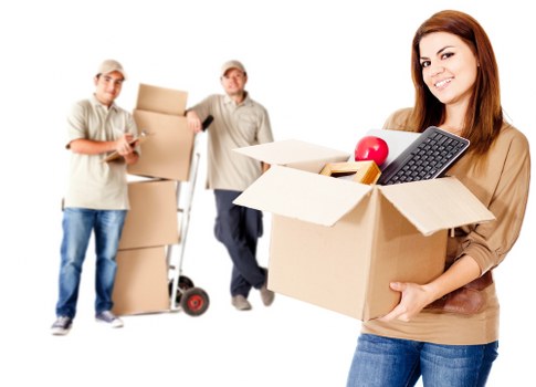Expert packers labeling and organizing boxes